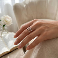 Christian woman wearing silver faith ring with cross 
crystal detail on finger Bible faith moment