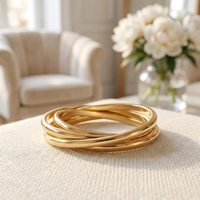 Three-band interlocked gold fidget ring close-up detail 
showing rolling bands and polished finish