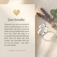 Just breathe affirmation message card with 
silver wrap ring on cream linen — heartfelt 
strength reminder gift for anxiety stress relief