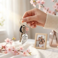 Daughter holding keys with engraved heart keychain from mom emotional daily moment