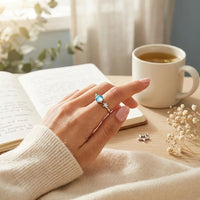 Young woman wearing Star and Moon celestial 
ring on finger — dreamy mindfulness anxiety 
relief daily wear for daughters