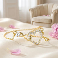 Linked Forever necklace pendant detail two interlocking hearts gold and crystal close-up